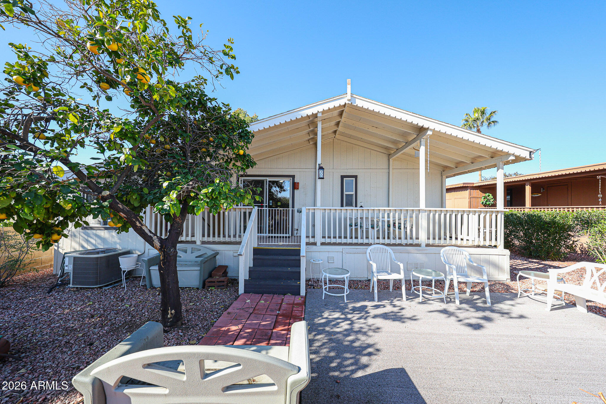 3901 East Pinnacle Peak Road, Unit 270 Phoenix, AZ 85050 - Photo 23 of 27 a view of a house with backyard and sitting area