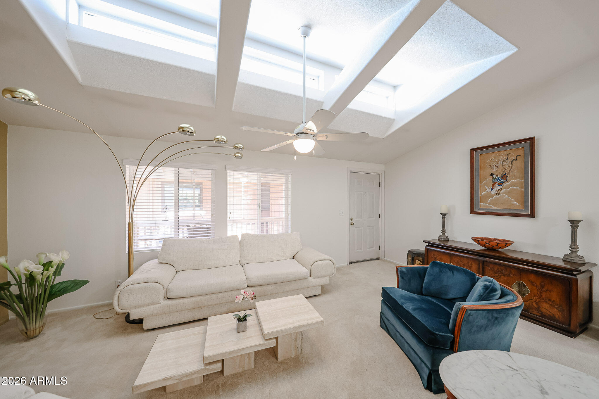 3901 East Pinnacle Peak Road, Unit 270 Phoenix, AZ 85050 - Photo 3 of 27 a living room with furniture and a large window