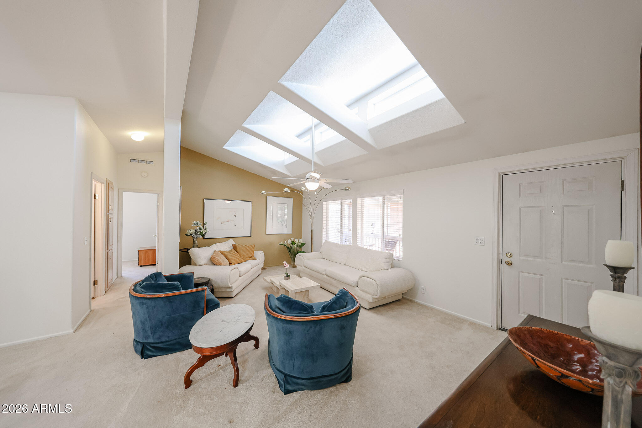 3901 East Pinnacle Peak Road, Unit 270 Phoenix, AZ 85050 - Photo 4 of 27 a living room with furniture and a window