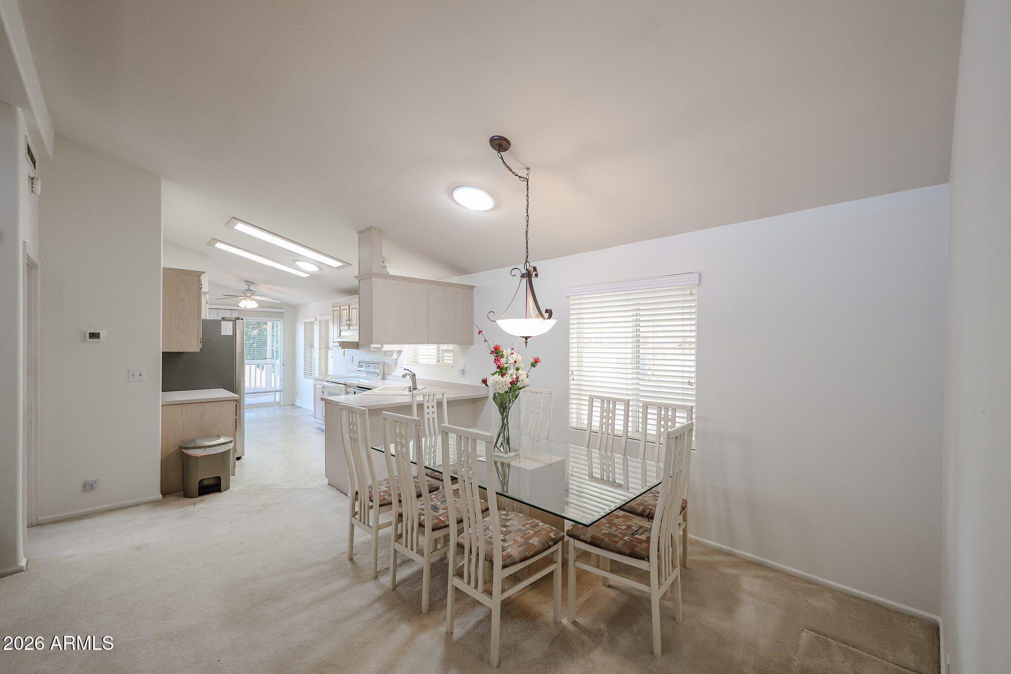 3901 East Pinnacle Peak Road, Unit 270 Phoenix, AZ 85050 - Photo 6 of 27 a dining room with furniture and window