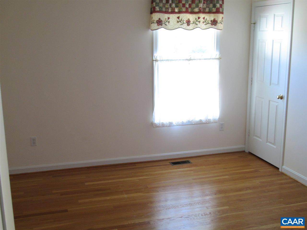 730 River Road Madison, VA 22727 - Photo 12 of 23 a view of an empty room with wooden floor and a window