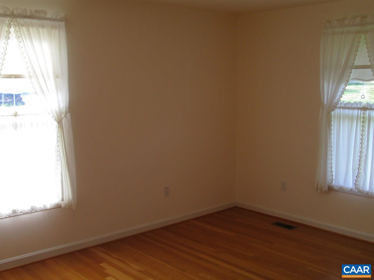 730 River Road Madison, VA 22727 - Photo 13 of 23 an empty room with wooden floor and windows