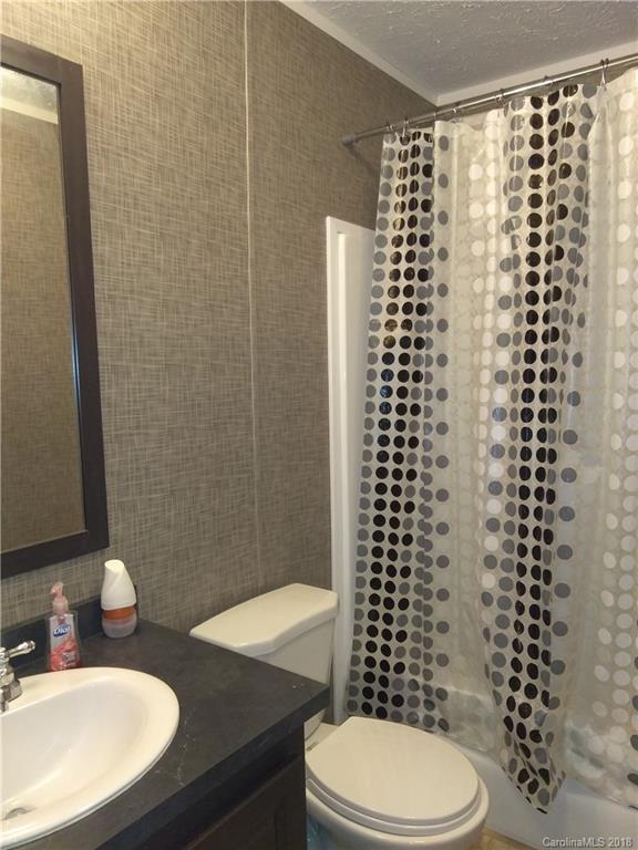 486 Sandifer Road York, SC 29745 - Photo 14 of 19 a bathroom with a shower a toilet and a sink
