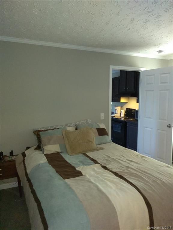 486 Sandifer Road York, SC 29745 - Photo 8 of 19 a bedroom with a bed and a window