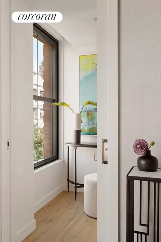 a spacious bedroom with a bed and a large window