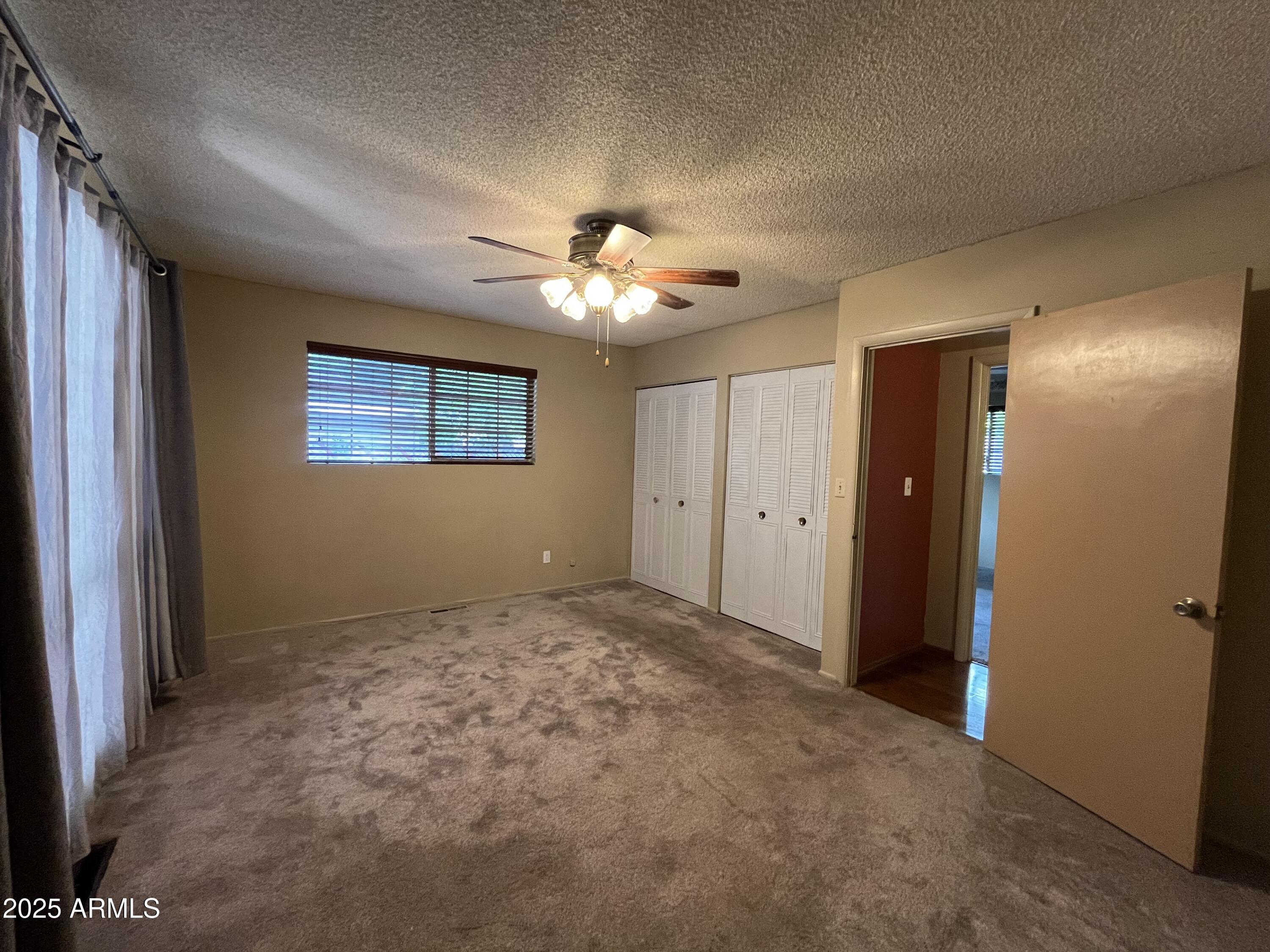 1707 North Fort Valley Road Flagstaff, AZ 86001 - Photo 5 of 14 a view of an empty room with a chandelier fan