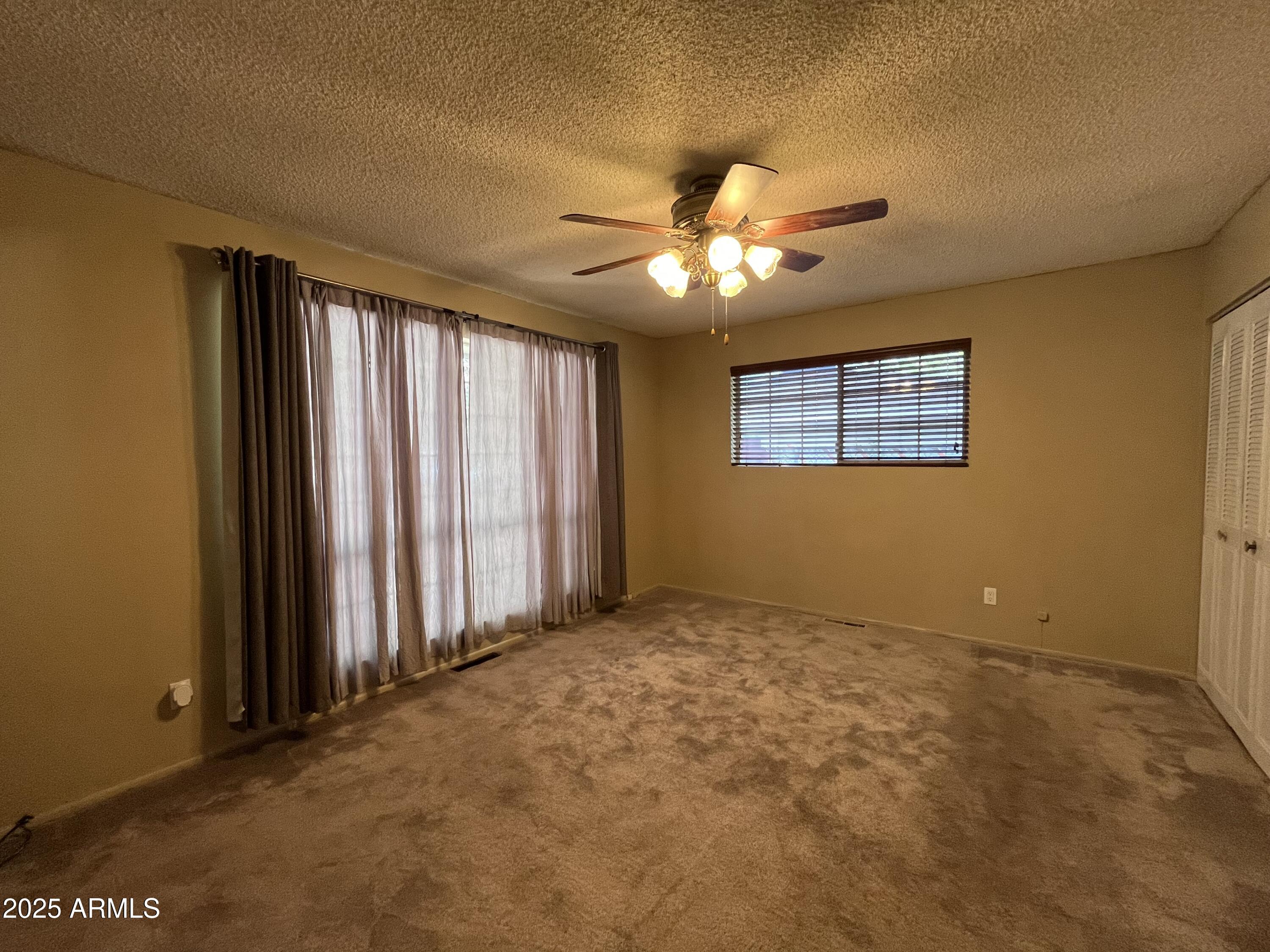 1707 North Fort Valley Road Flagstaff, AZ 86001 - Photo 6 of 14 a view of an empty room with a window