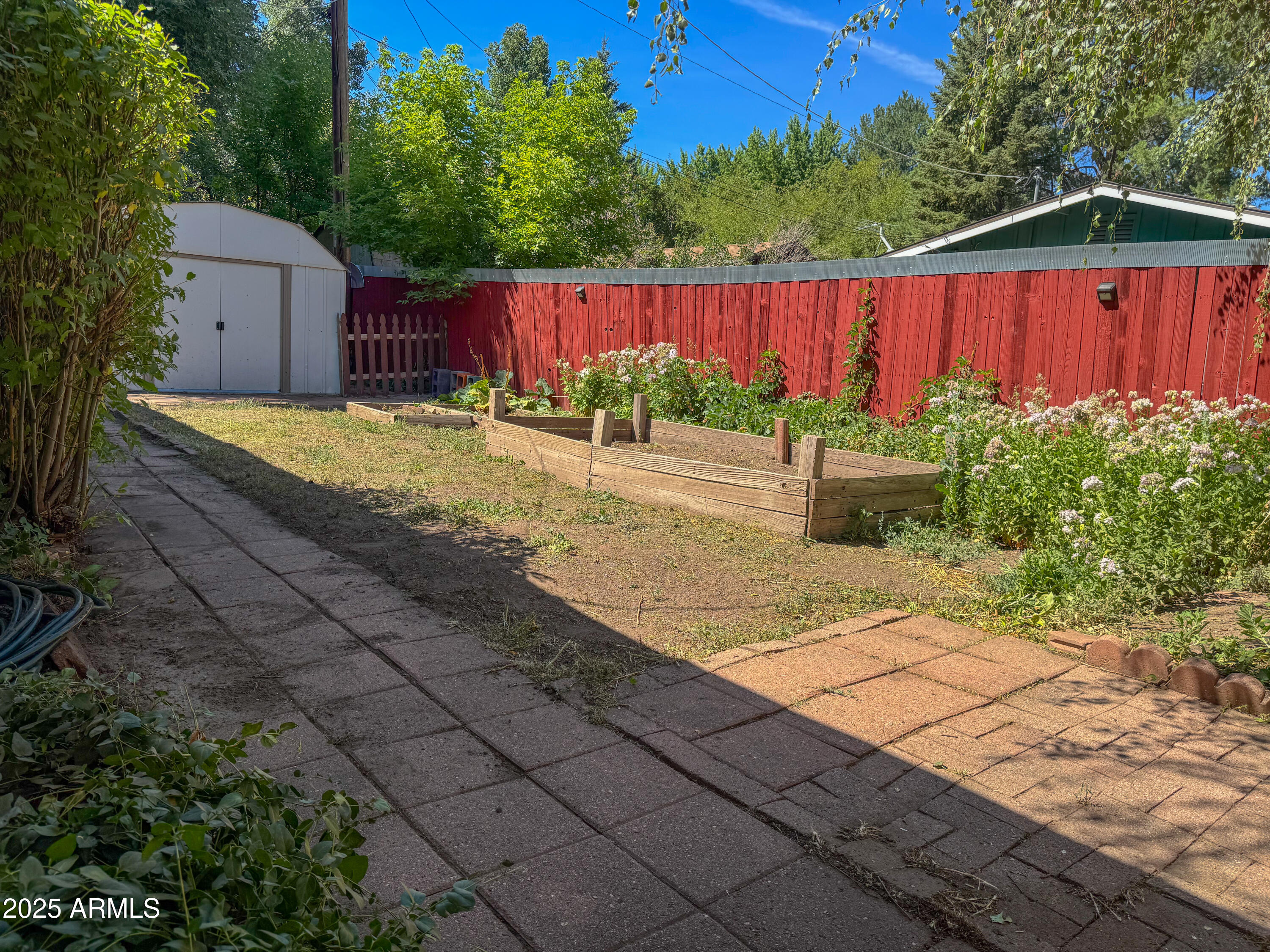 1707 North Fort Valley Road Flagstaff, AZ 86001 - Photo 9 of 14 a view of a backyard with a small pool and wooden fence