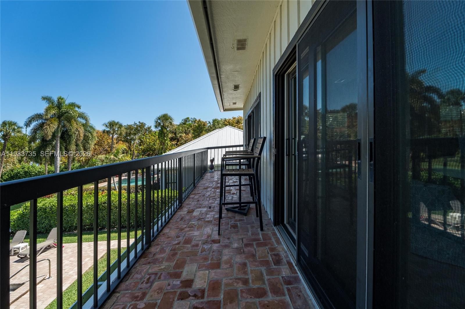 851 Saturn Street, Unit D Jupiter, FL 33477 - Photo 27 of 60 a view of balcony with furniture