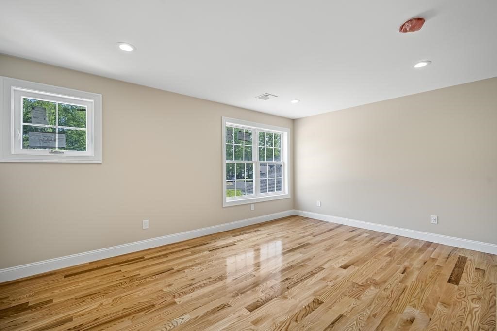4 Sabrina Way, Unit F Feeding Hills, MA 01030 - Photo 25 of 34 a view of an empty room with wooden floor and a window