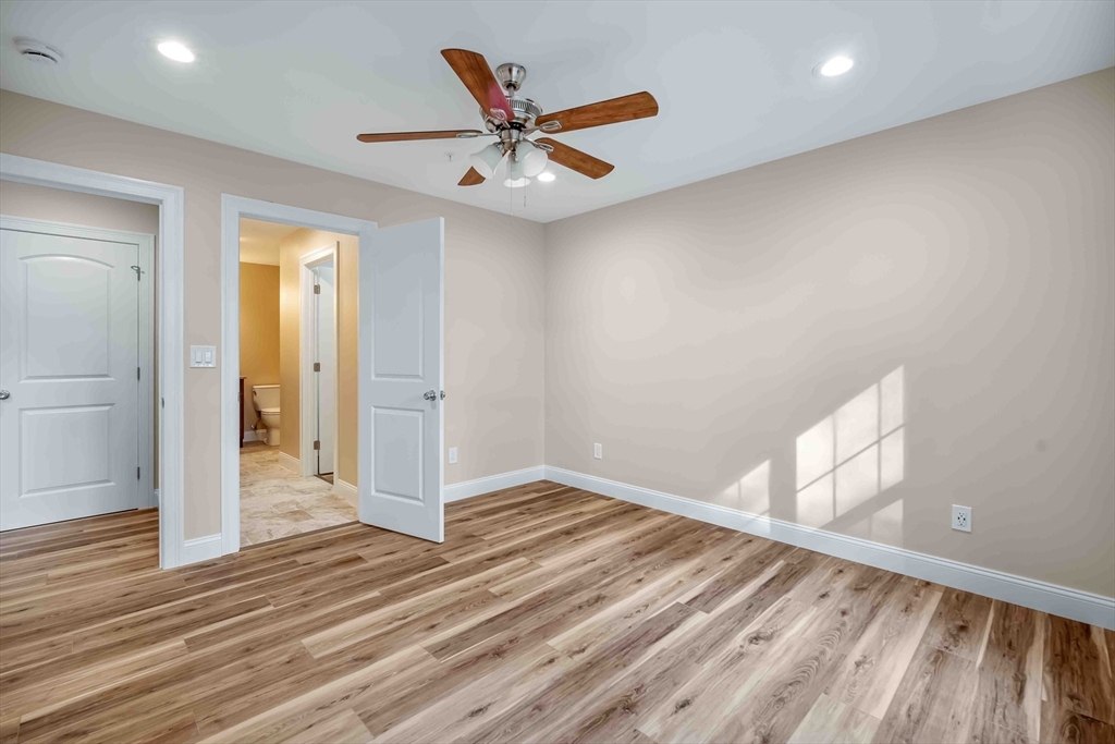 4 Sabrina Way, Unit F Feeding Hills, MA 01030 - Photo 33 of 34 a view of a livingroom with wooden floor and a ceiling fan