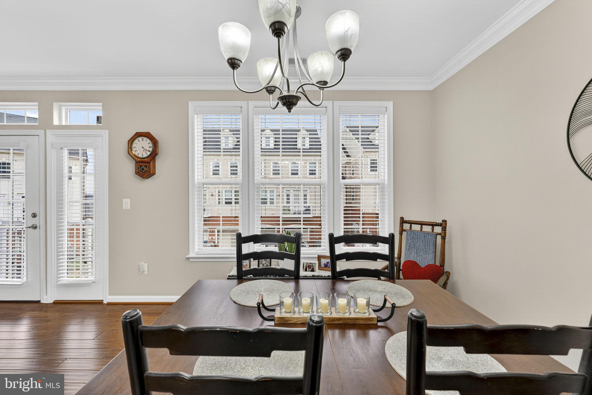 42558 Sunset Ridge Square Ashburn, VA 20148 - Photo 24 of 51 a view of a dining room with furniture and wooden floor