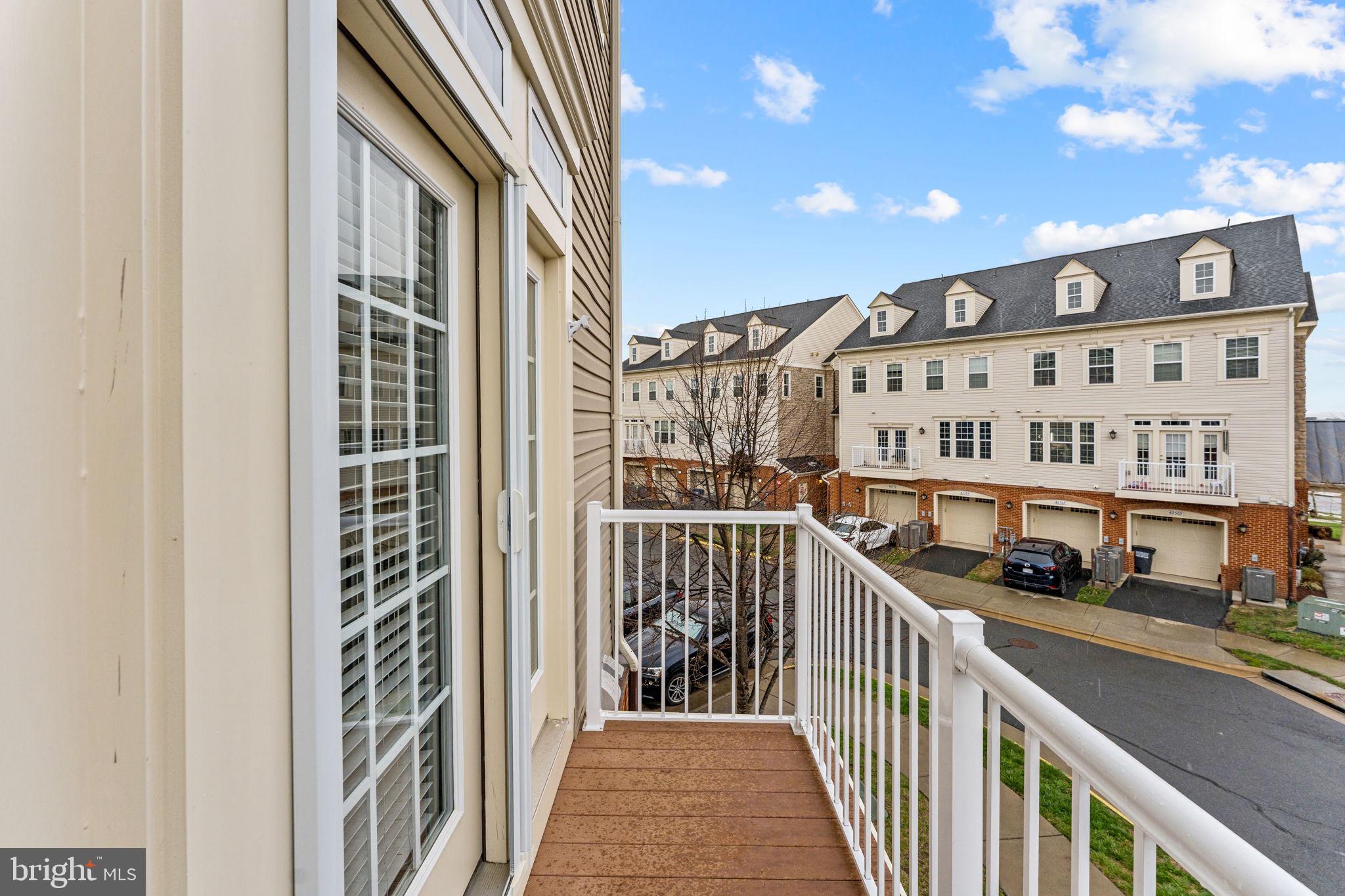 42558 Sunset Ridge Square Ashburn, VA 20148 - Photo 26 of 51 a view of a balcony with city view