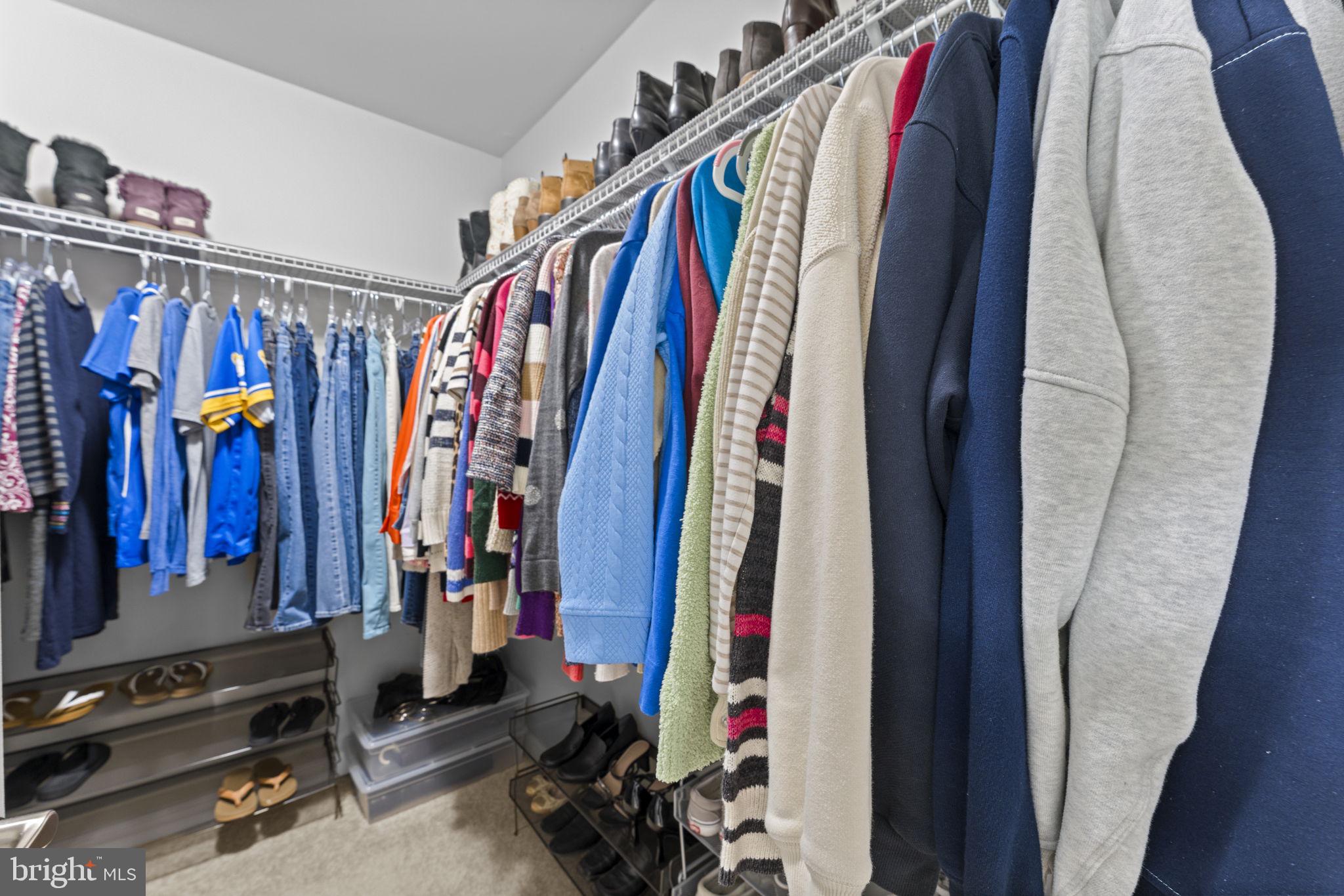 42558 Sunset Ridge Square Ashburn, VA 20148 - Photo 37 of 51 a view of walk in closet with clothes
