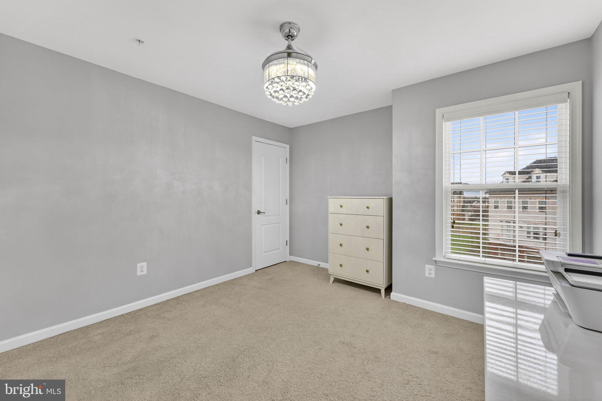 42558 Sunset Ridge Square Ashburn, VA 20148 - Photo 45 of 51 a view of an empty room with a window