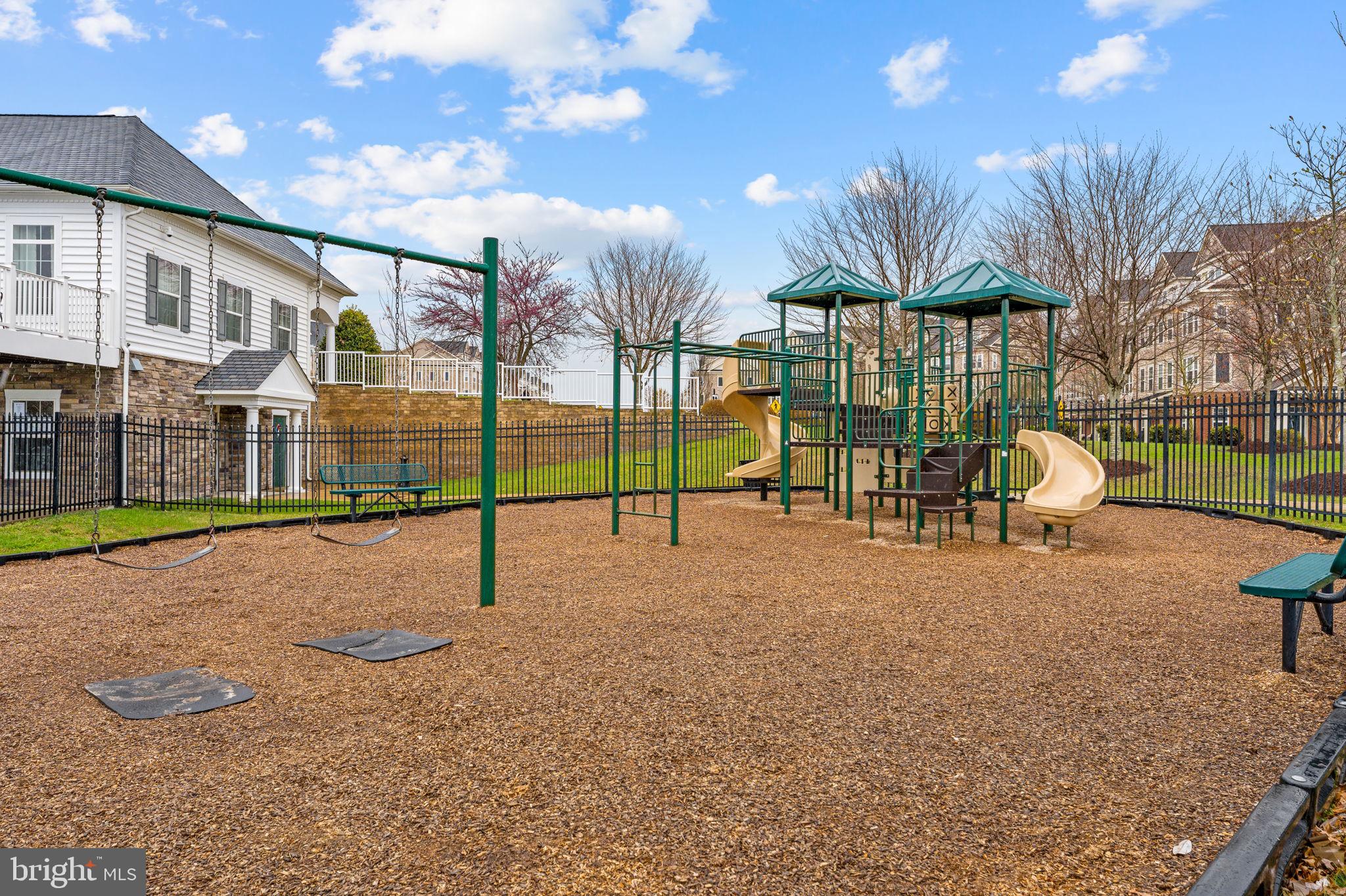 42558 Sunset Ridge Square Ashburn, VA 20148 - Photo 47 of 51 a view of a house with backyard and a patio