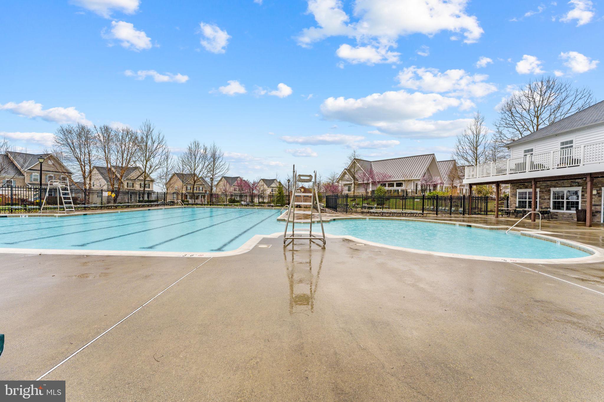 42558 Sunset Ridge Square Ashburn, VA 20148 - Photo 48 of 51 a view of a swimming pool with a yard