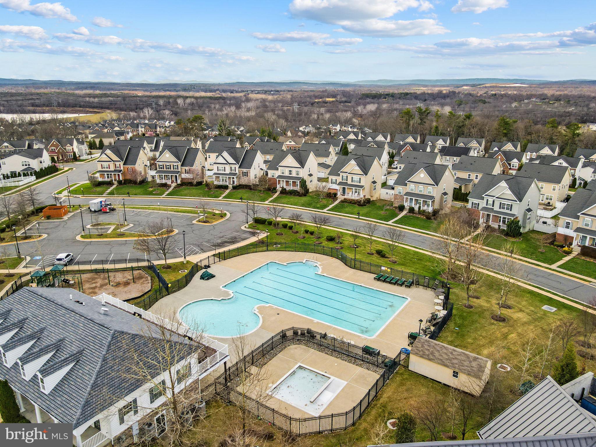 42558 Sunset Ridge Square Ashburn, VA 20148 - Photo 49 of 51 an aerial view of residential houses with outdoor space