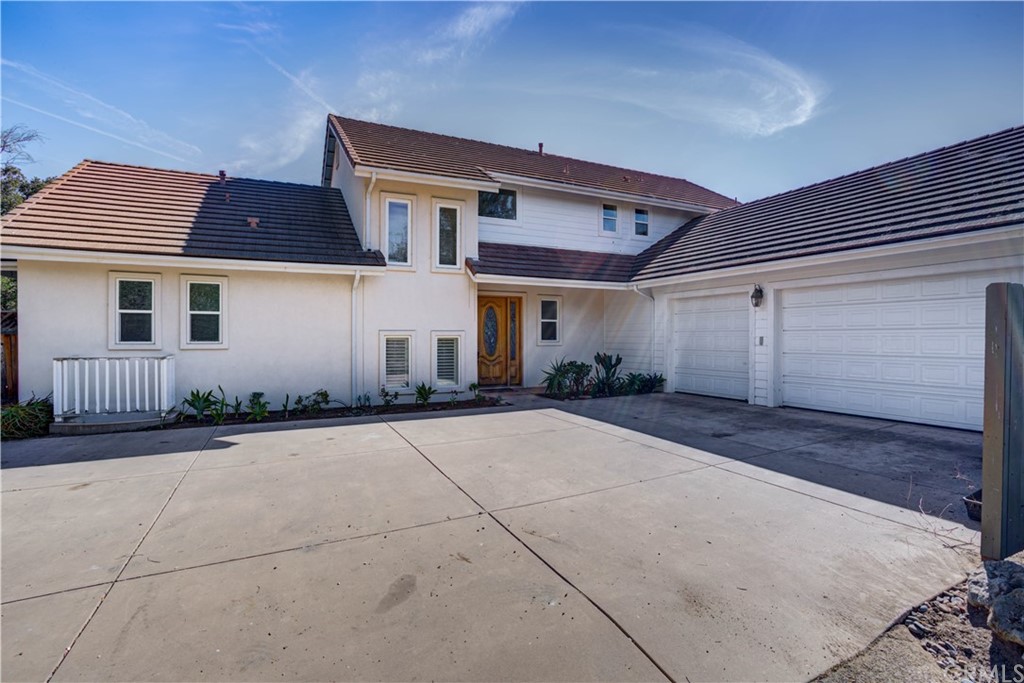 1163 Willow Road Nipomo, CA 93444 - Photo 1 of 1 a front view of a house with a garage