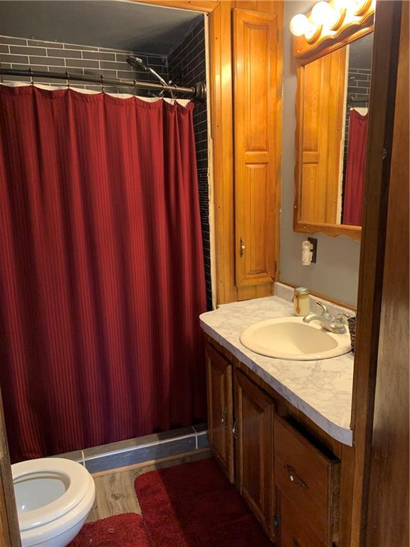 729 Cemetery Road Perryopolis, PA 15473 - Photo 13 of 24 a bathroom with a sink and a mirror