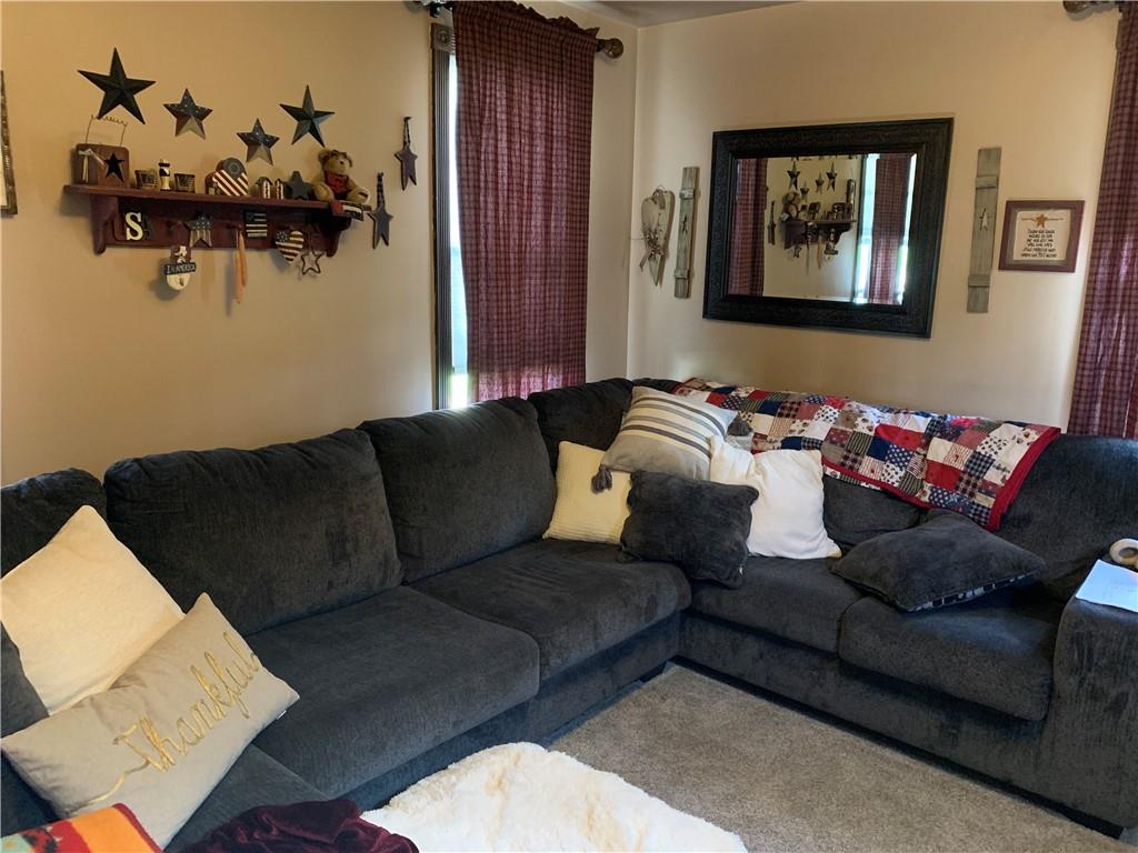 729 Cemetery Road Perryopolis, PA 15473 - Photo 17 of 24 a living room with furniture flowerpot and a mirror
