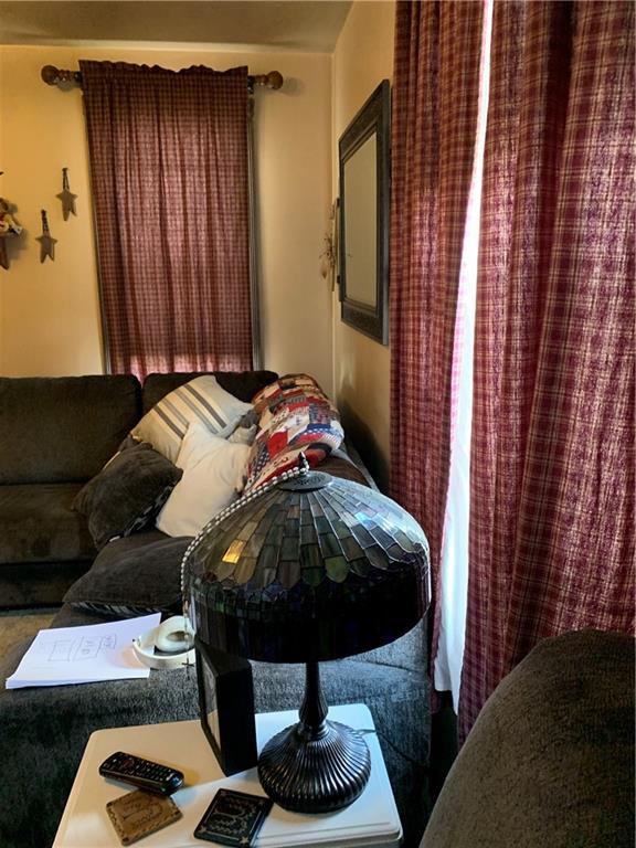 729 Cemetery Road Perryopolis, PA 15473 - Photo 18 of 24 a bed sitting in a bedroom next to a window