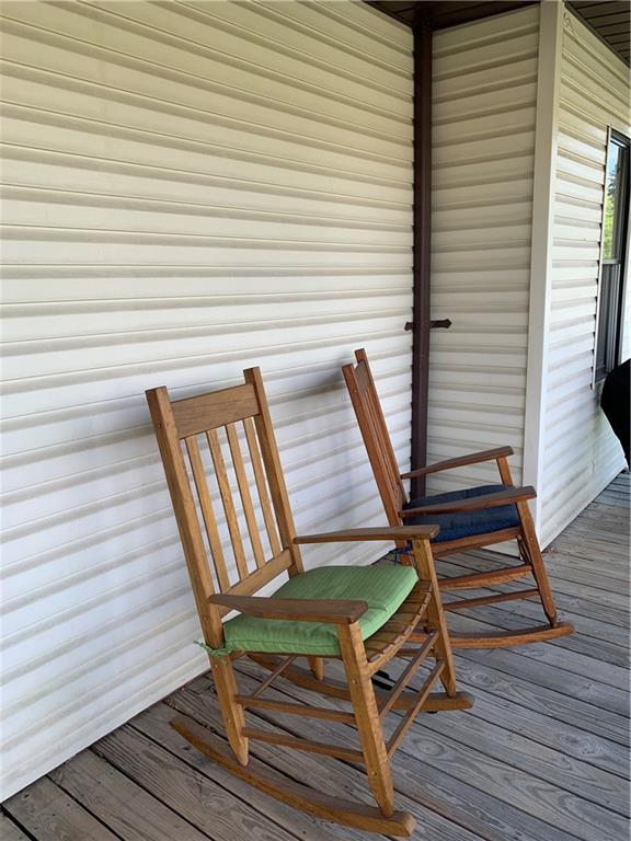 729 Cemetery Road Perryopolis, PA 15473 - Photo 7 of 24 a view of a wooden chairs on the deck