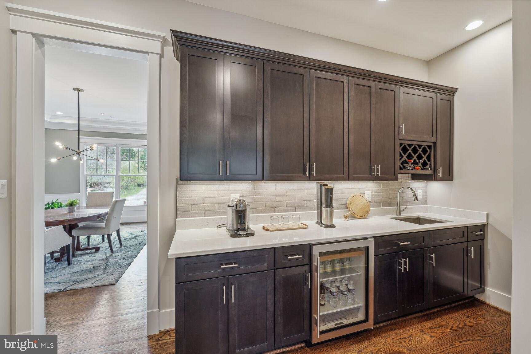 7708 Massena Road Bethesda, MD 20817 - Photo 21 of 78 Butler's pantry w/wet bar, mini fridge, cabinets