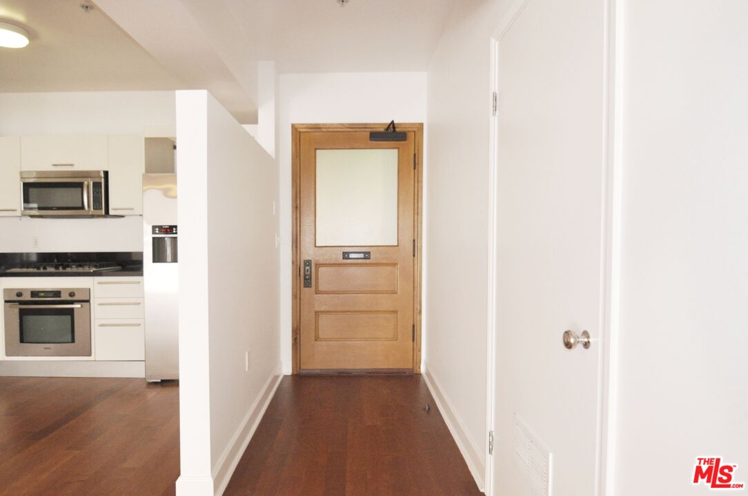 416 South Spring Street, Unit 805 Los Angeles, CA 90013 - Photo 18 of 24 a view of a hallway with storage and utility
