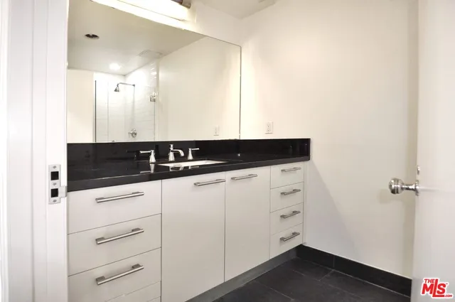 a close view of a utility room with cabinets