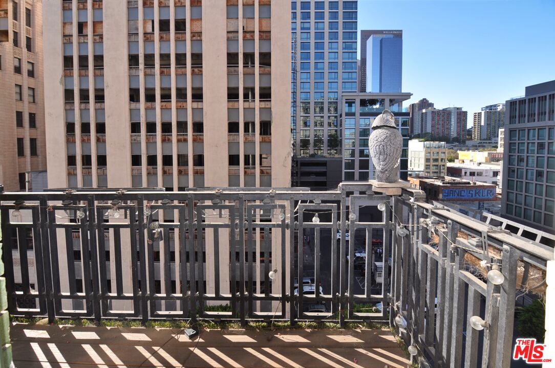 416 South Spring Street, Unit 805 Los Angeles, CA 90013 - Photo 10 of 24 a view of a street with tall buildings