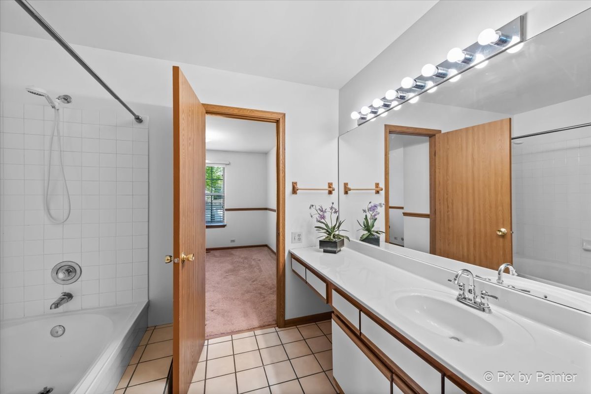 1664 Pebble Beach Circle Elgin, IL 60123 - Photo 14 of 24 a en suite spacious bathroom with a tub sink and mirror