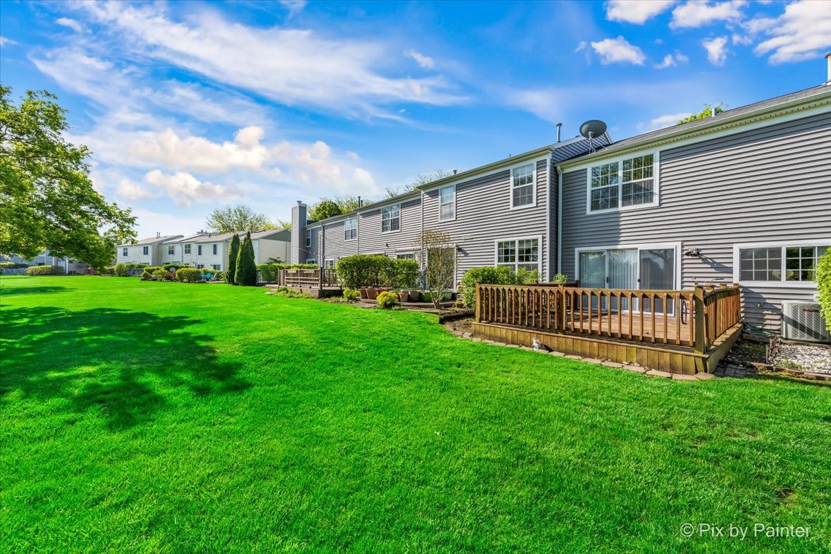1664 Pebble Beach Circle Elgin, IL 60123 - Photo 20 of 24 a view of a house with backyard and porch
