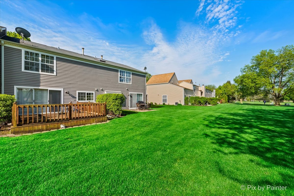 1664 Pebble Beach Circle Elgin, IL 60123 - Photo 21 of 24 a front view of house with yard barbeque and outdoor seating