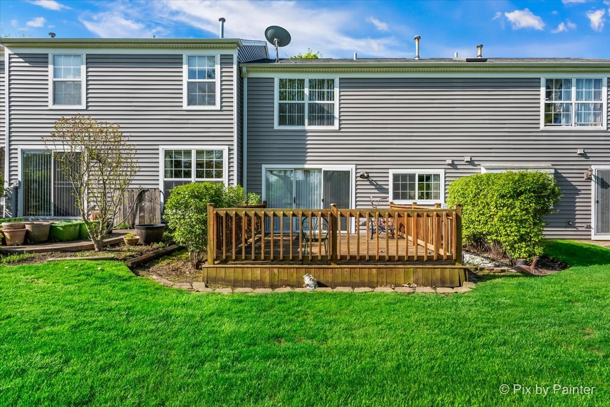 1664 Pebble Beach Circle Elgin, IL 60123 - Photo 22 of 24 a view of a house with a yard and furniture