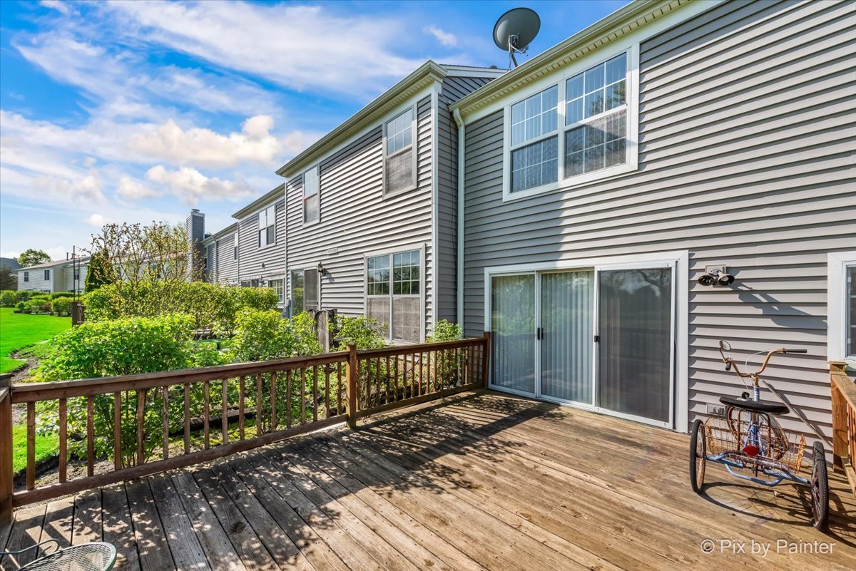 1664 Pebble Beach Circle Elgin, IL 60123 - Photo 23 of 24 a front view of a house with a balcony