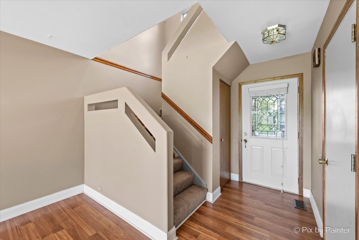 1664 Pebble Beach Circle Elgin, IL 60123 - Photo 3 of 24 a view of entryway with wooden floor