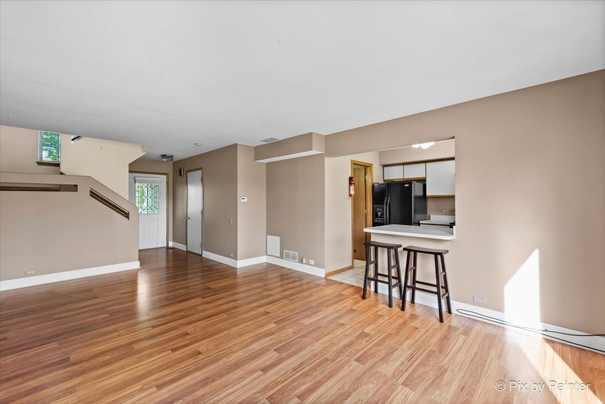 1664 Pebble Beach Circle Elgin, IL 60123 - Photo 6 of 24 a view of empty room with wooden floor