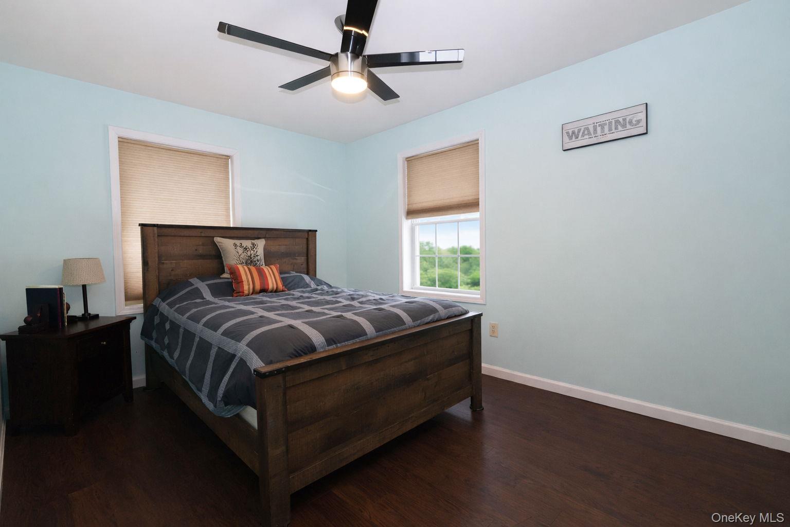 1 Decker Farm Road Monticello, NY 12701 - Photo 11 of 12 a bedroom with a bed and wooden floor