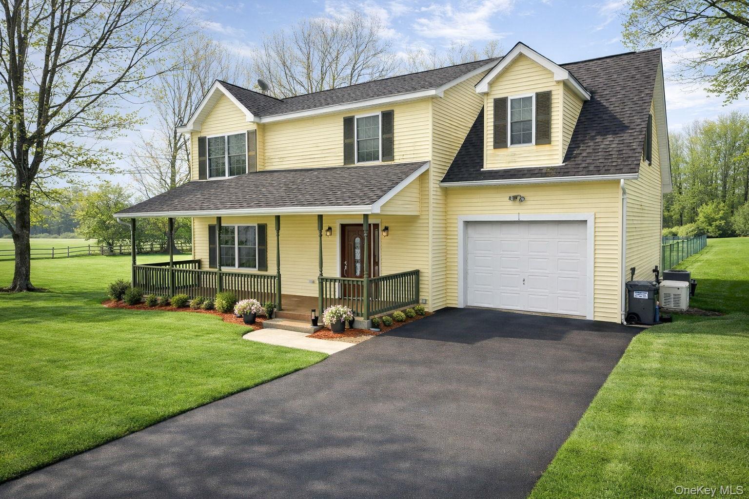 1 Decker Farm Road Monticello, NY 12701 - Photo 2 of 12 a front view of a house with a yard and trees