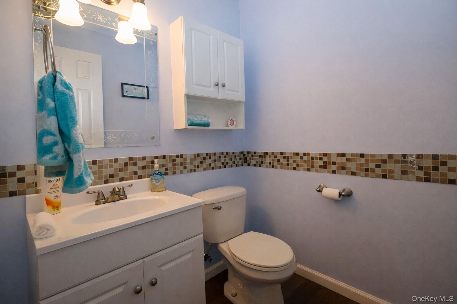 1 Decker Farm Road Monticello, NY 12701 - Photo 6 of 12 a bathroom with a sink a toilet and mirror