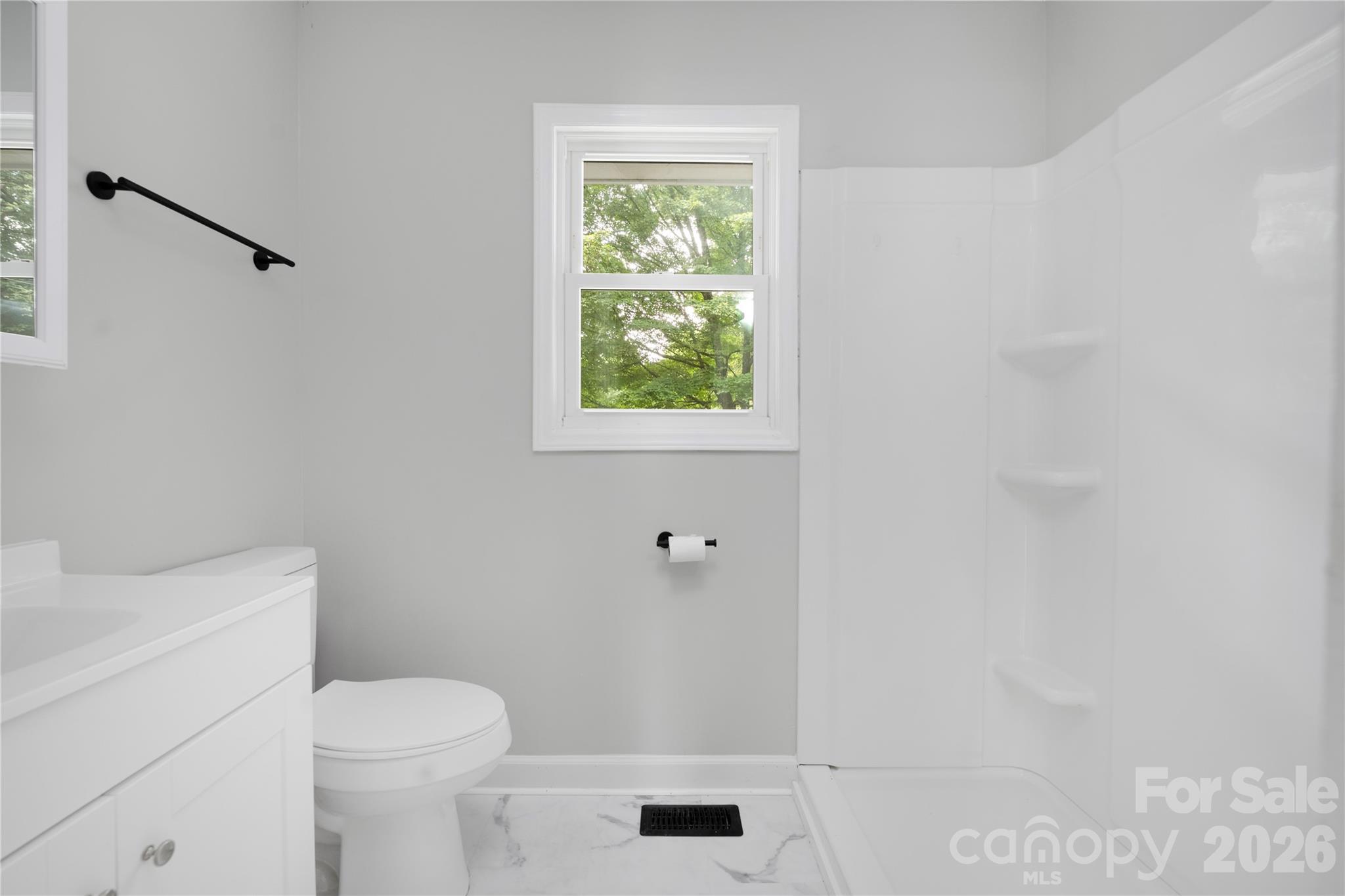 146 Staton Road Gastonia, NC 28056 - Photo 12 of 25 a bathroom with a toilet and a shower