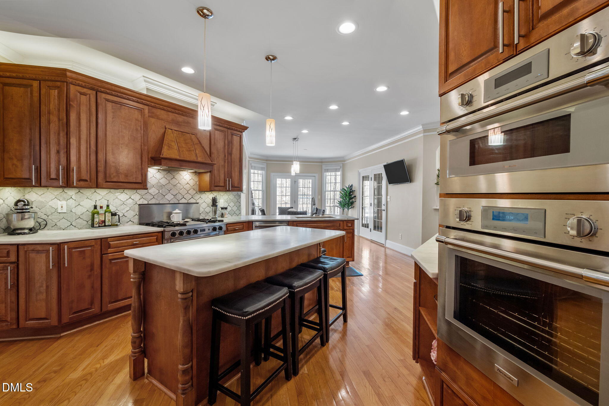 825 Oxbow Crossing Road Chapel Hill, NC 27516 - Photo 12 of 86 a kitchen with stainless steel appliances kitchen island granite countertop a stove a sink and a refrigerator