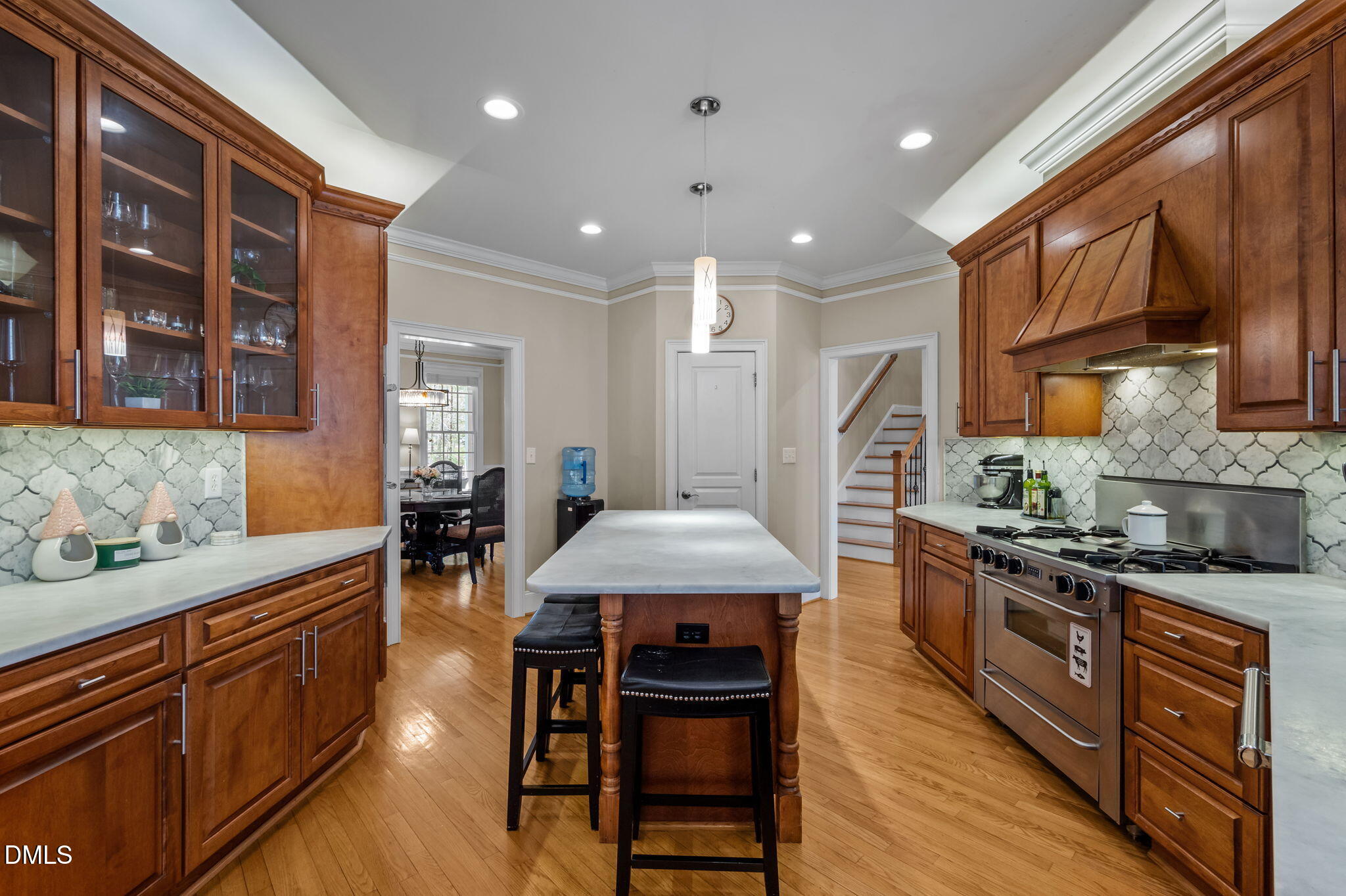 825 Oxbow Crossing Road Chapel Hill, NC 27516 - Photo 14 of 86 a kitchen with stainless steel appliances granite countertop a stove a sink dishwasher and a refrigerator with wooden floor