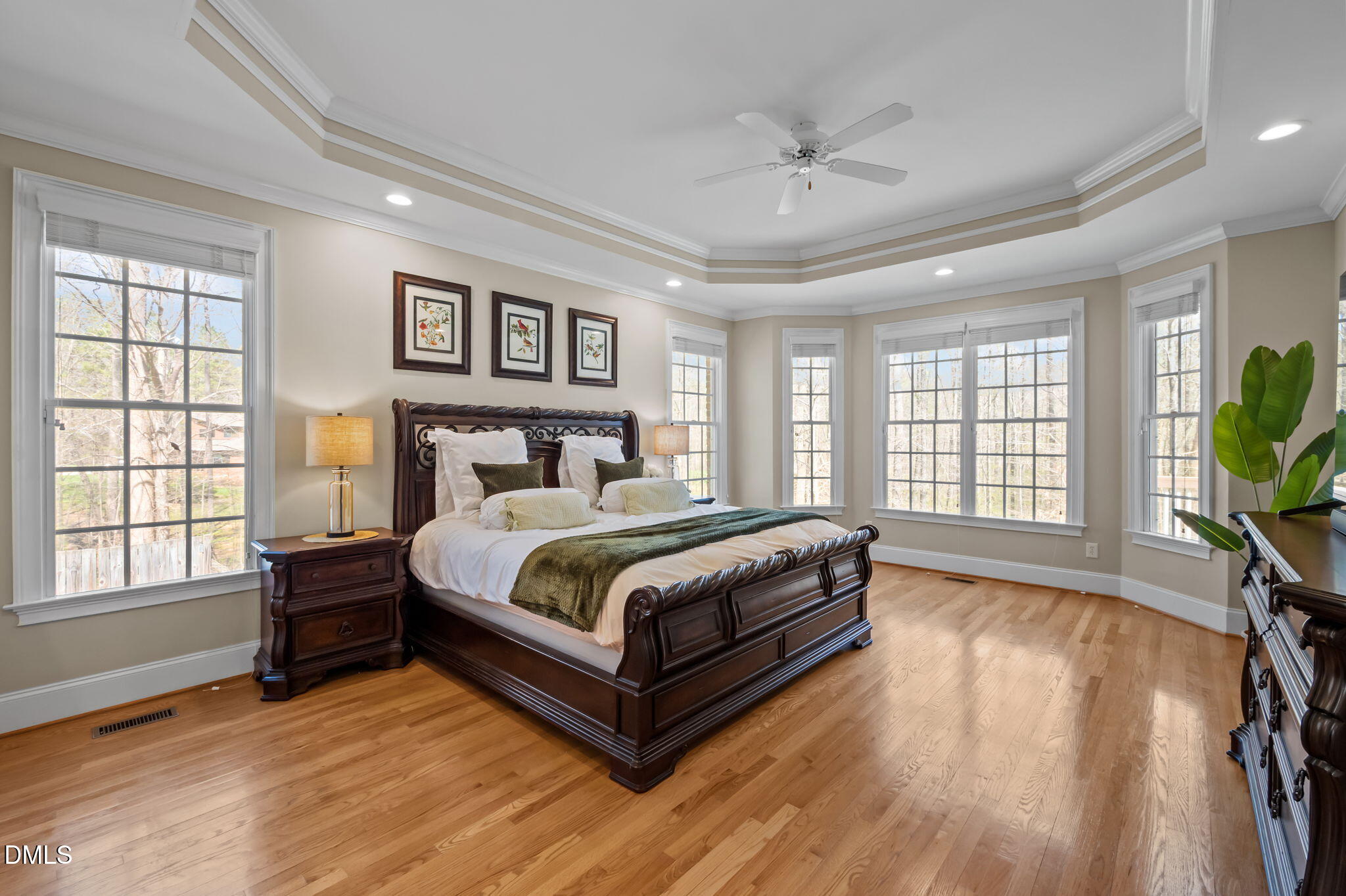825 Oxbow Crossing Road Chapel Hill, NC 27516 - Photo 18 of 86 a bedroom with a large bed wooden floor and window