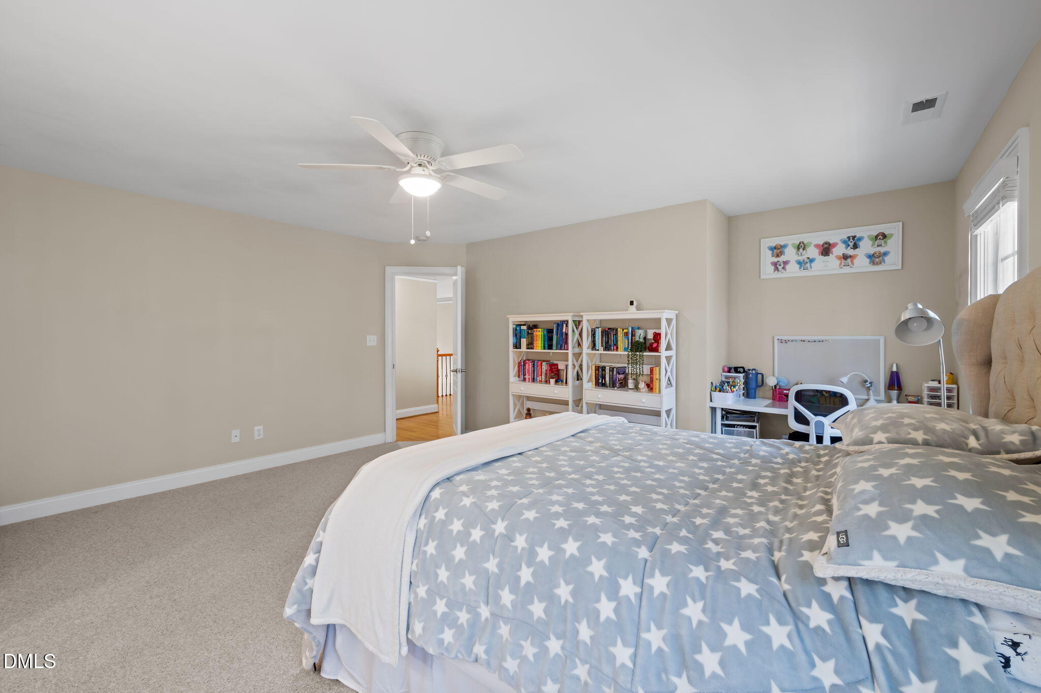 825 Oxbow Crossing Road Chapel Hill, NC 27516 - Photo 36 of 86 a bedroom with a bed and a chandelier