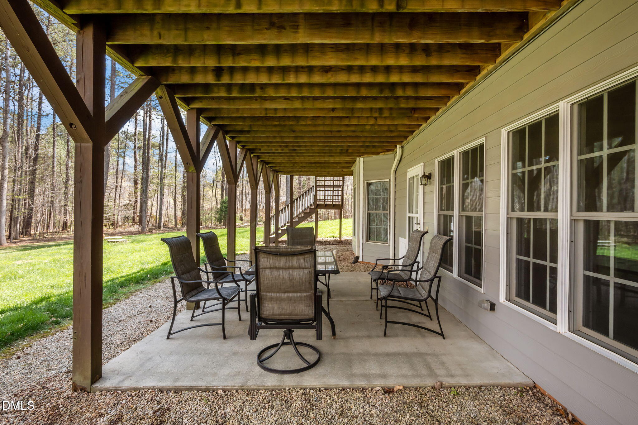 825 Oxbow Crossing Road Chapel Hill, NC 27516 - Photo 53 of 86 a view of a porch with chairs and backyard