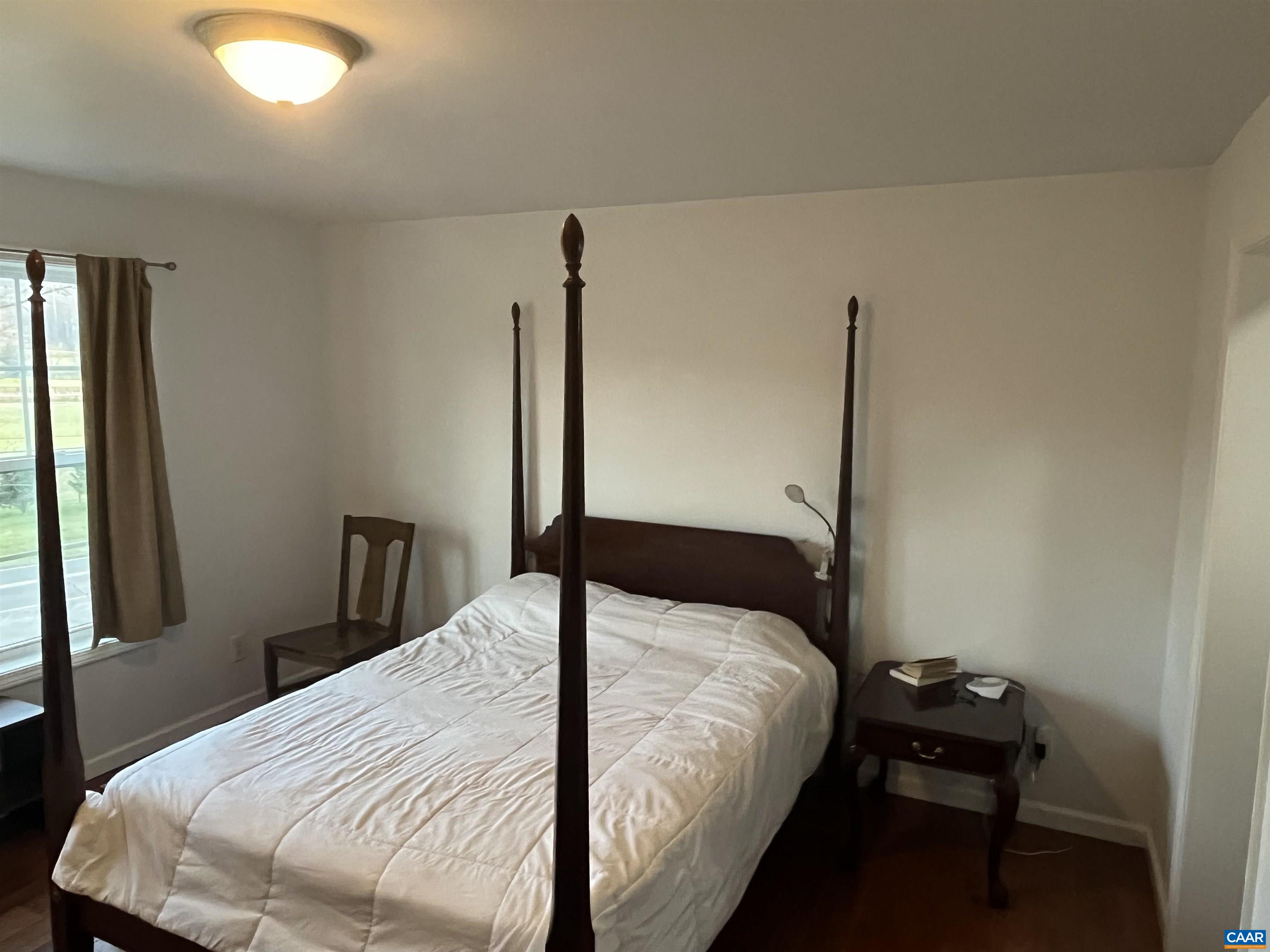 2150 Stony Point Road Charlottesville, VA 22911 - Photo 12 of 40 a bedroom with a bed and a window