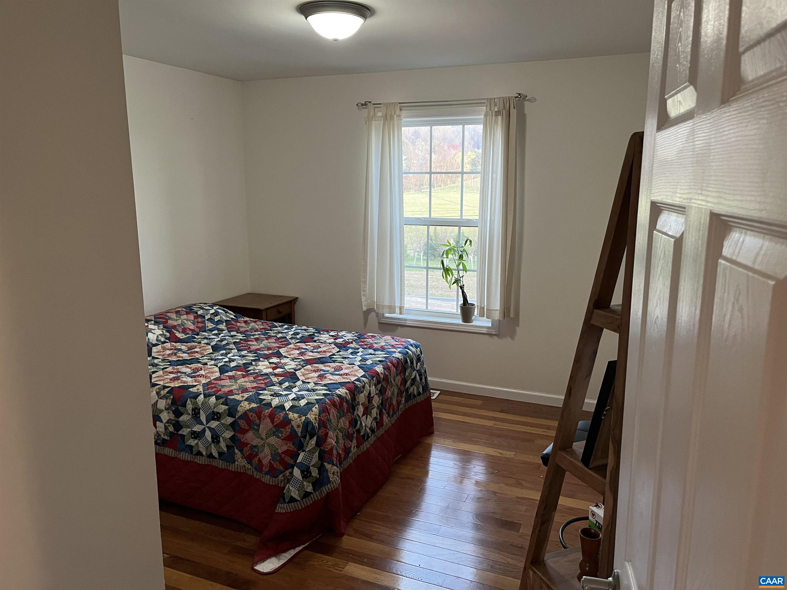 2150 Stony Point Road Charlottesville, VA 22911 - Photo 18 of 40 a bedroom with a bed and a window