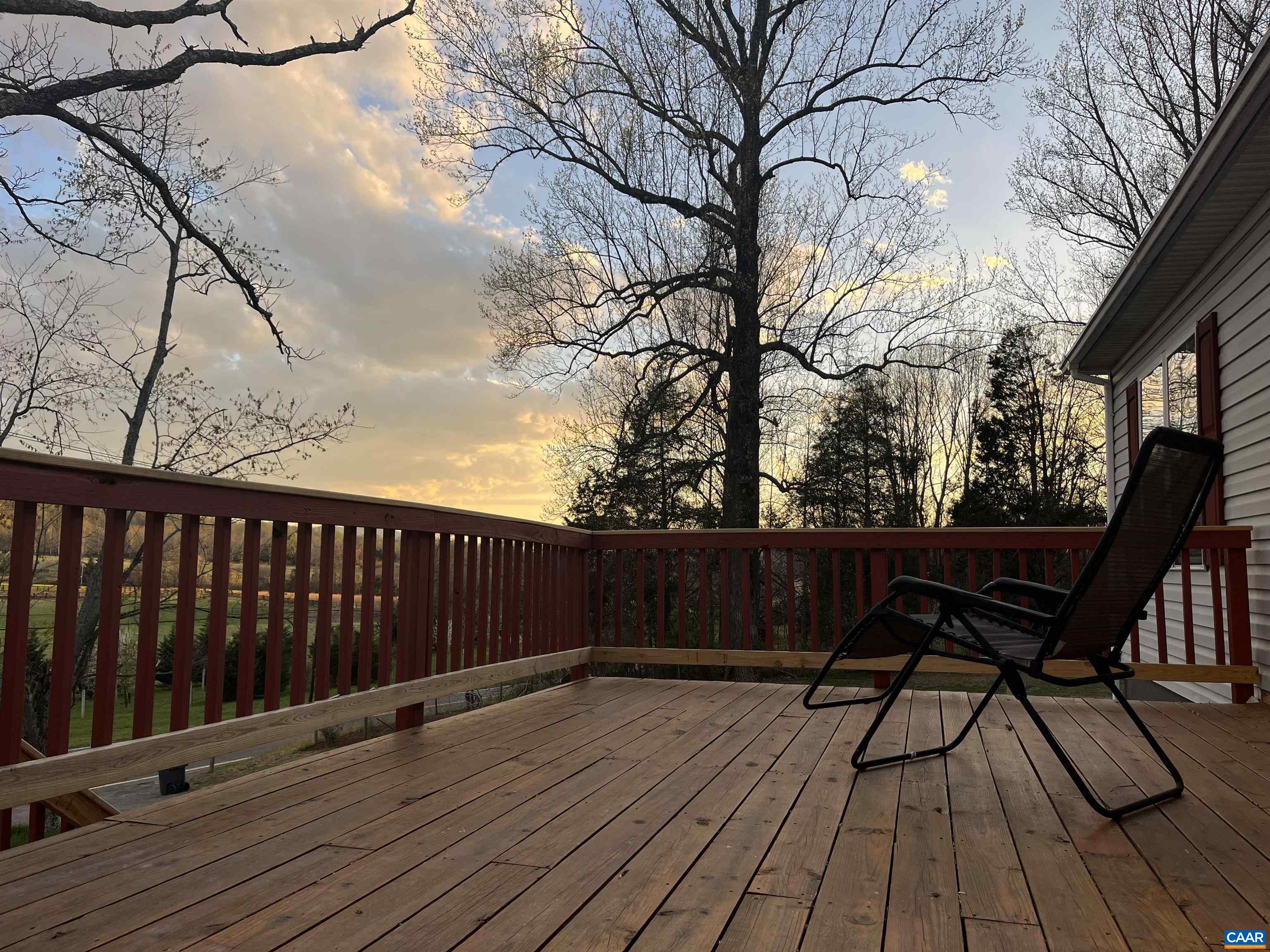 2150 Stony Point Road Charlottesville, VA 22911 - Photo 40 of 40 a view of a roof deck with wooden floor and bench